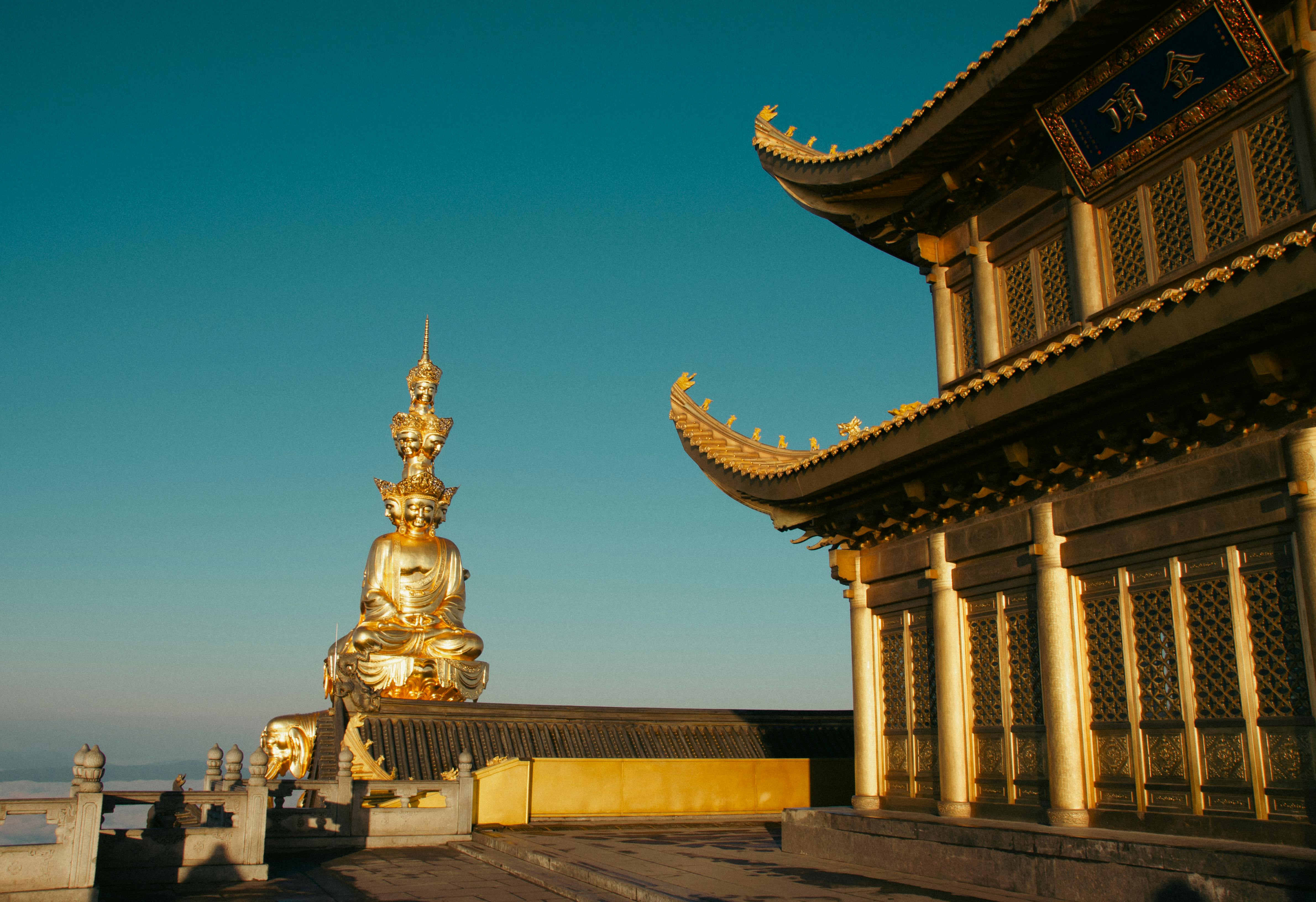 golden buddha and temple at mount emei