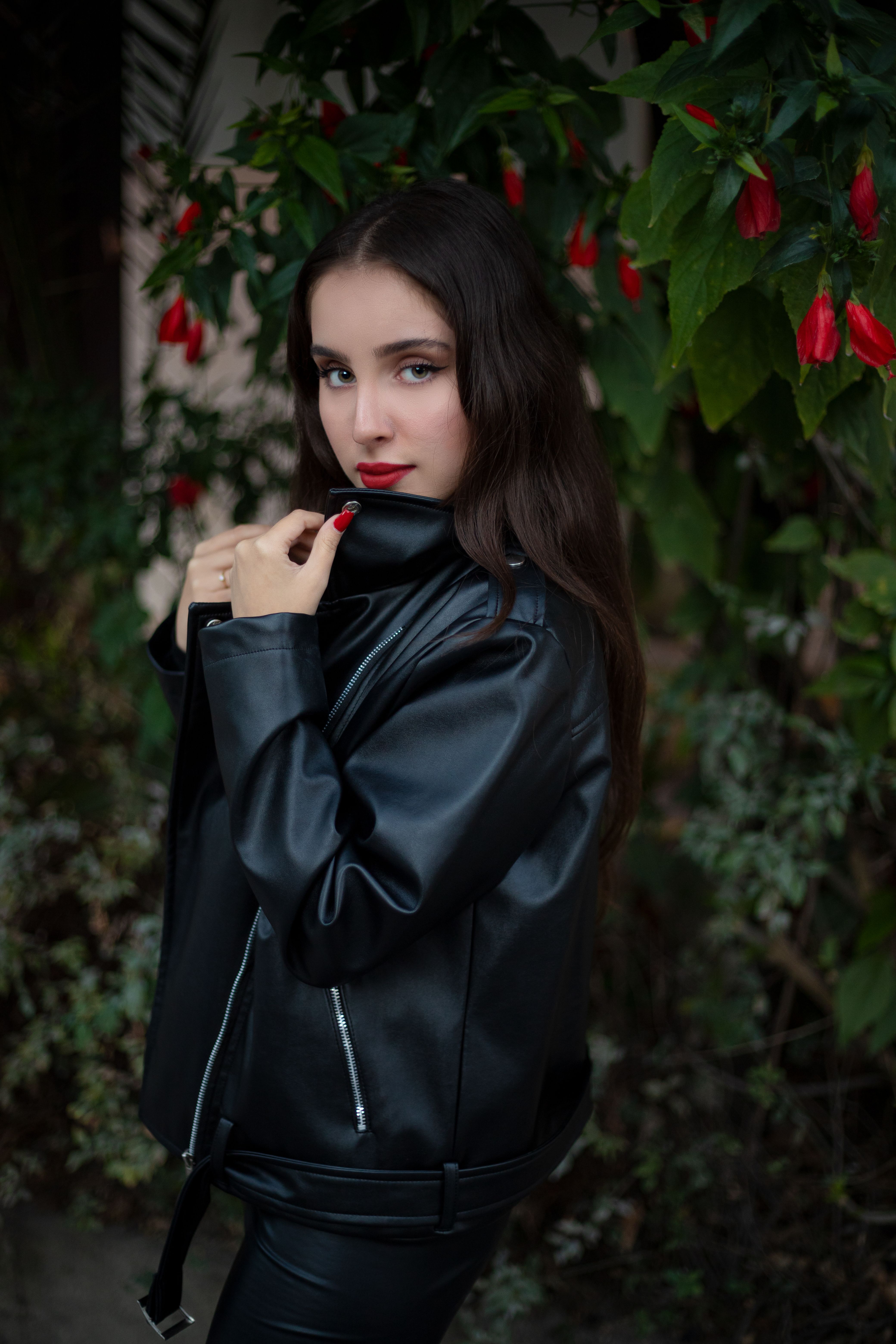 Elegant Woman Posing in Black Leather Jacket · Free Stock Photo