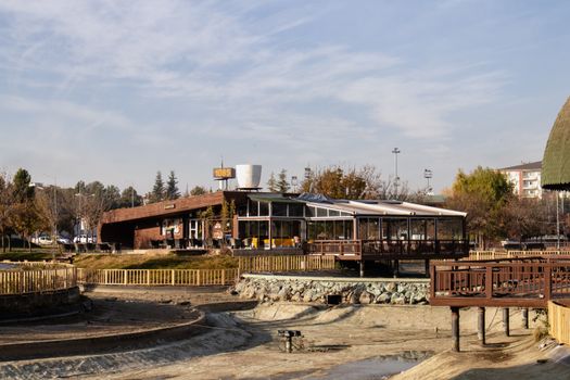 Charming outdoor café in Elazığ, Türkiye surrounded by autumn trees.