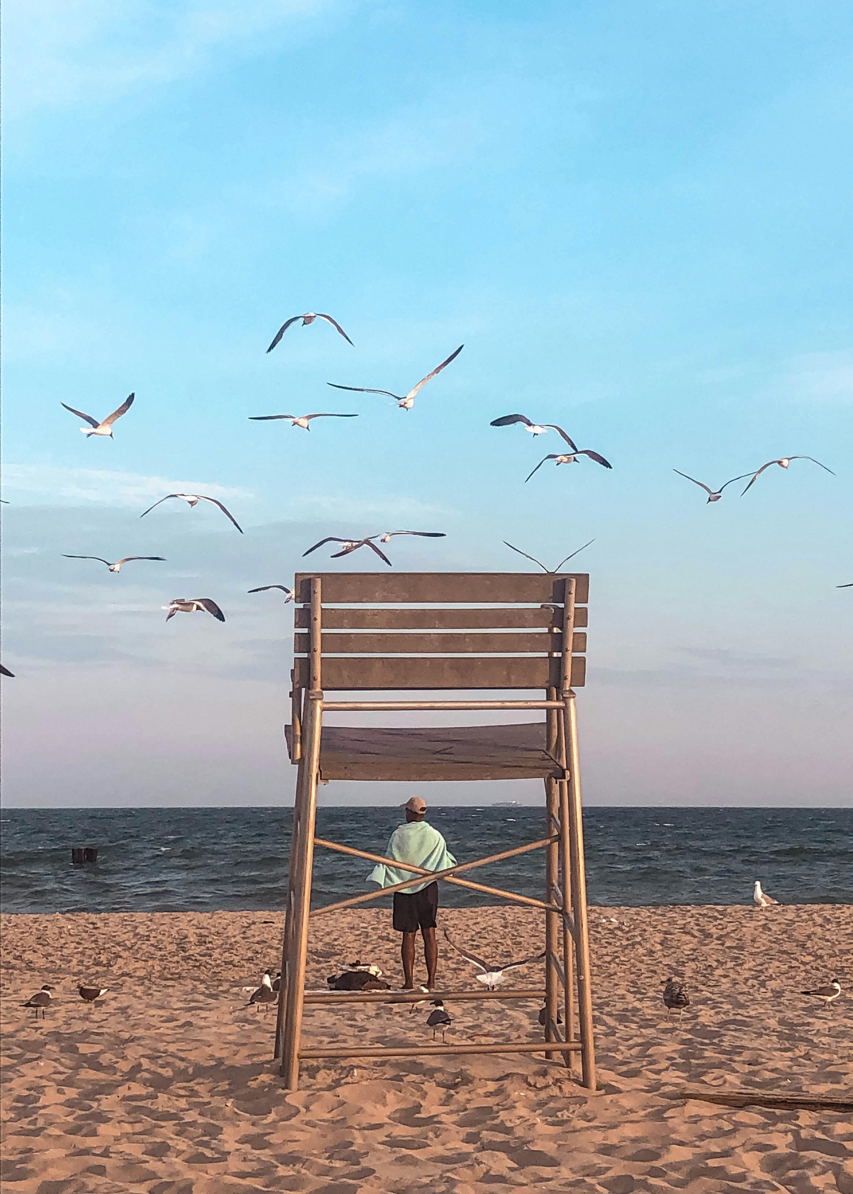 peaceful beach scene with lifeguard tower