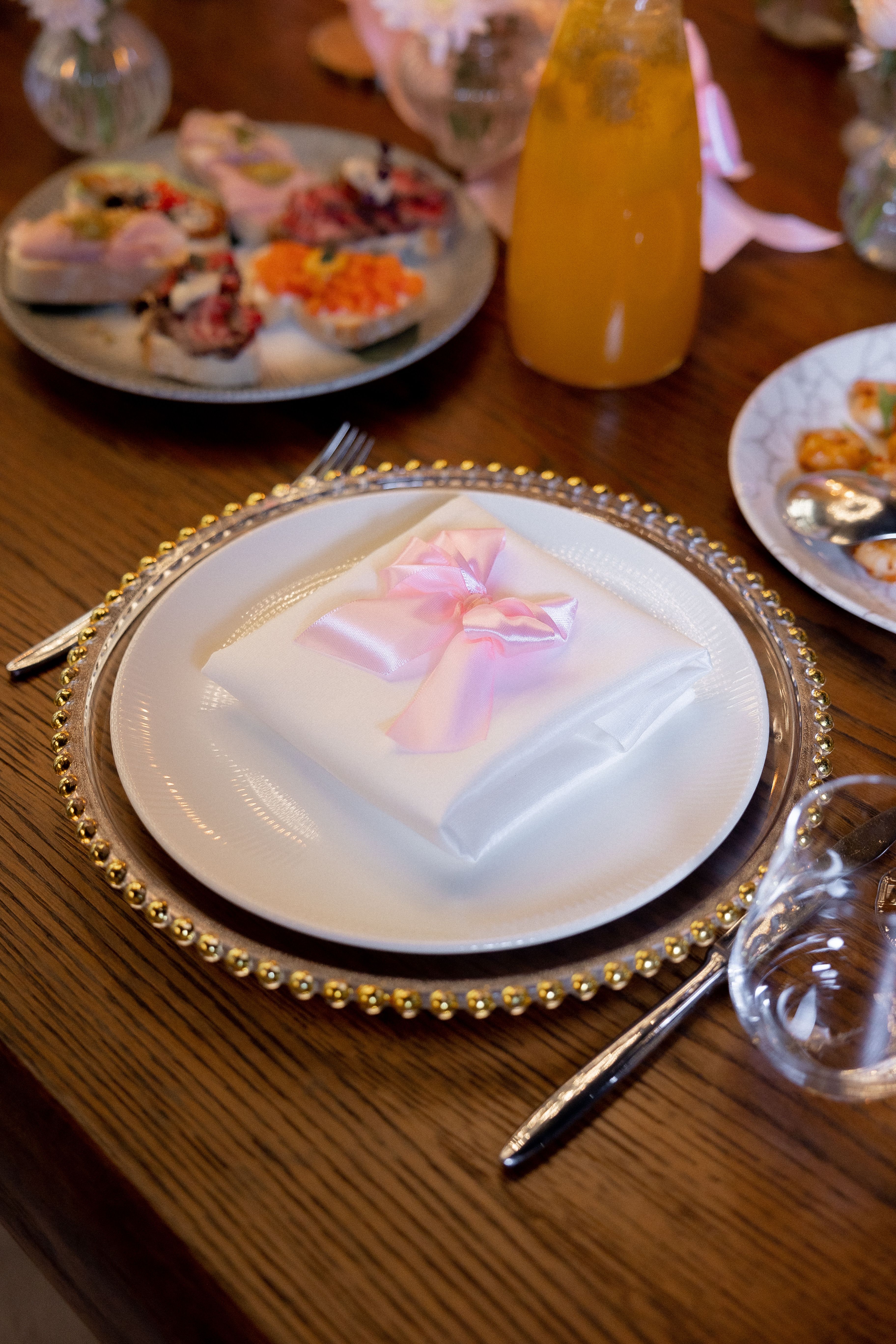 Elegant Table Setting with Pink Ribbon Napkin · Free Stock Photo
