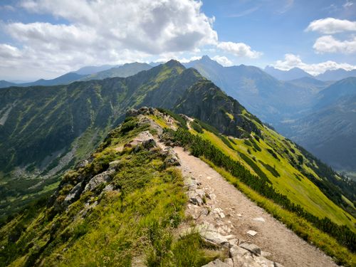 Free Explore a stunning mountain trail in the Tatra Mountains, perfect for hiking and adventure. Stock Photo