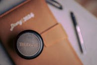 Creative Desk Setup with Diary and Speaker