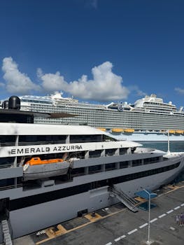 Elegant cruise ships docked under a clear sky, showcasing modern maritime travel.