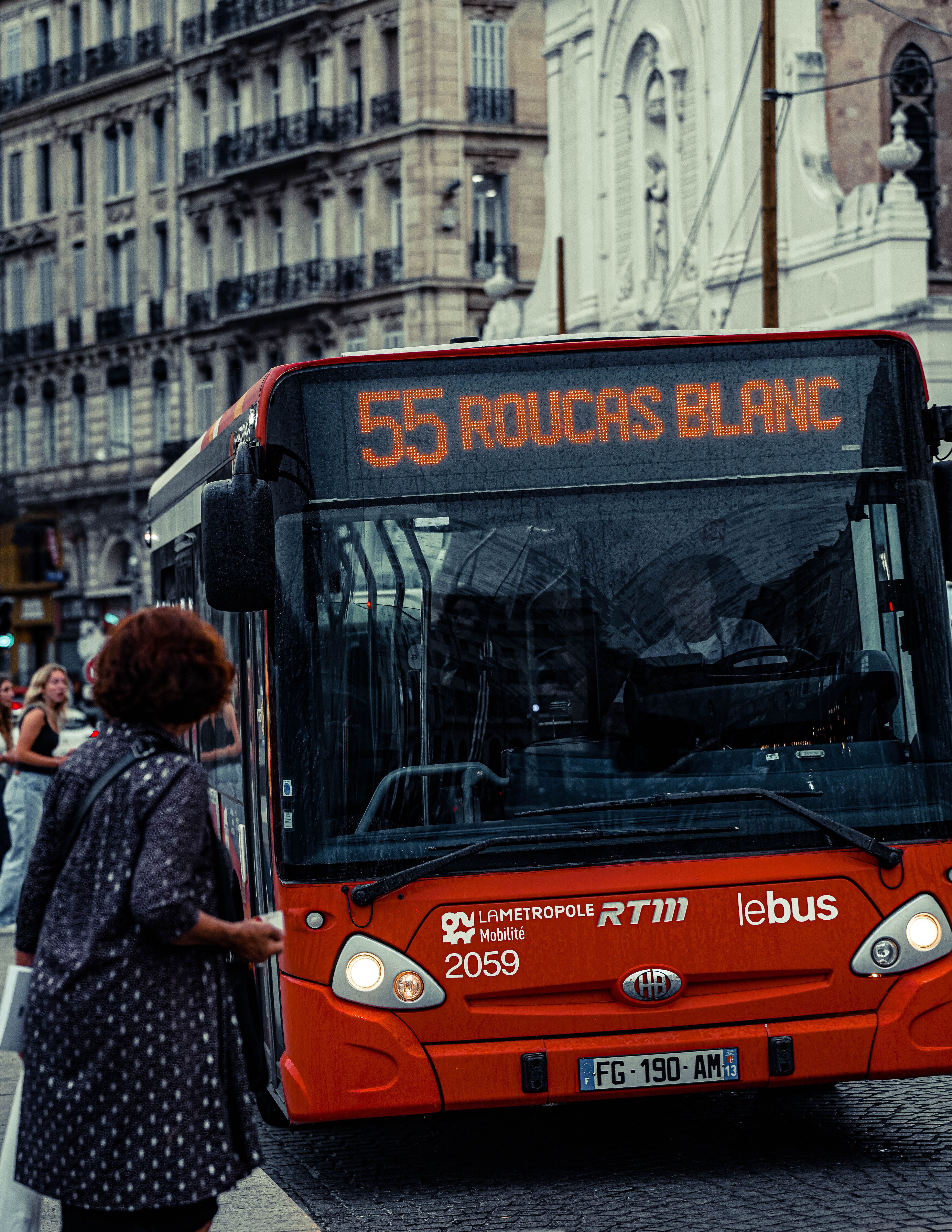 Captivating scene of a city bus at a Marseille stop, capturing urban life in France.