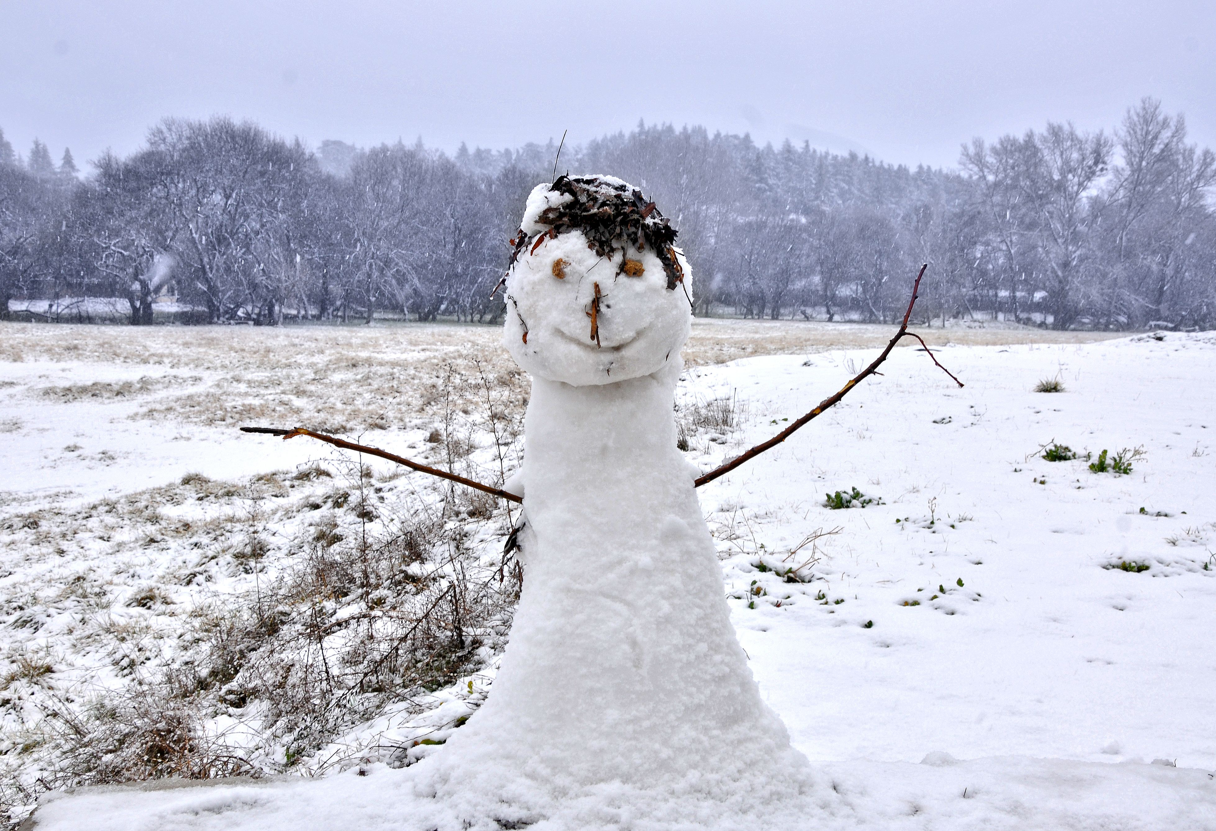 Charming snowman amidst a snowy landscape in Ifrane, Morocco during winter. - Ifrane