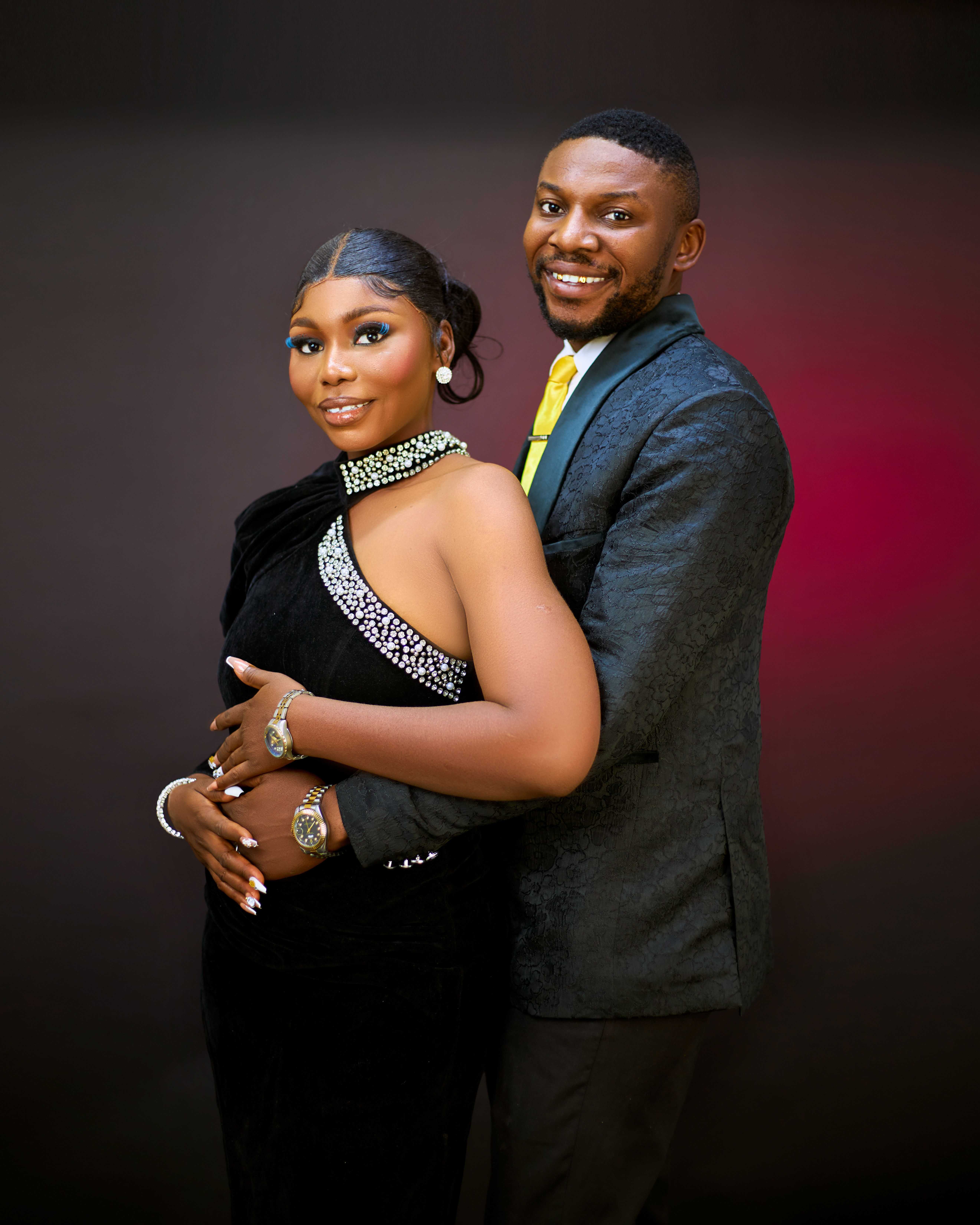 Sophisticated portrait of a couple dressed in formal evening wear, exuding elegance.
