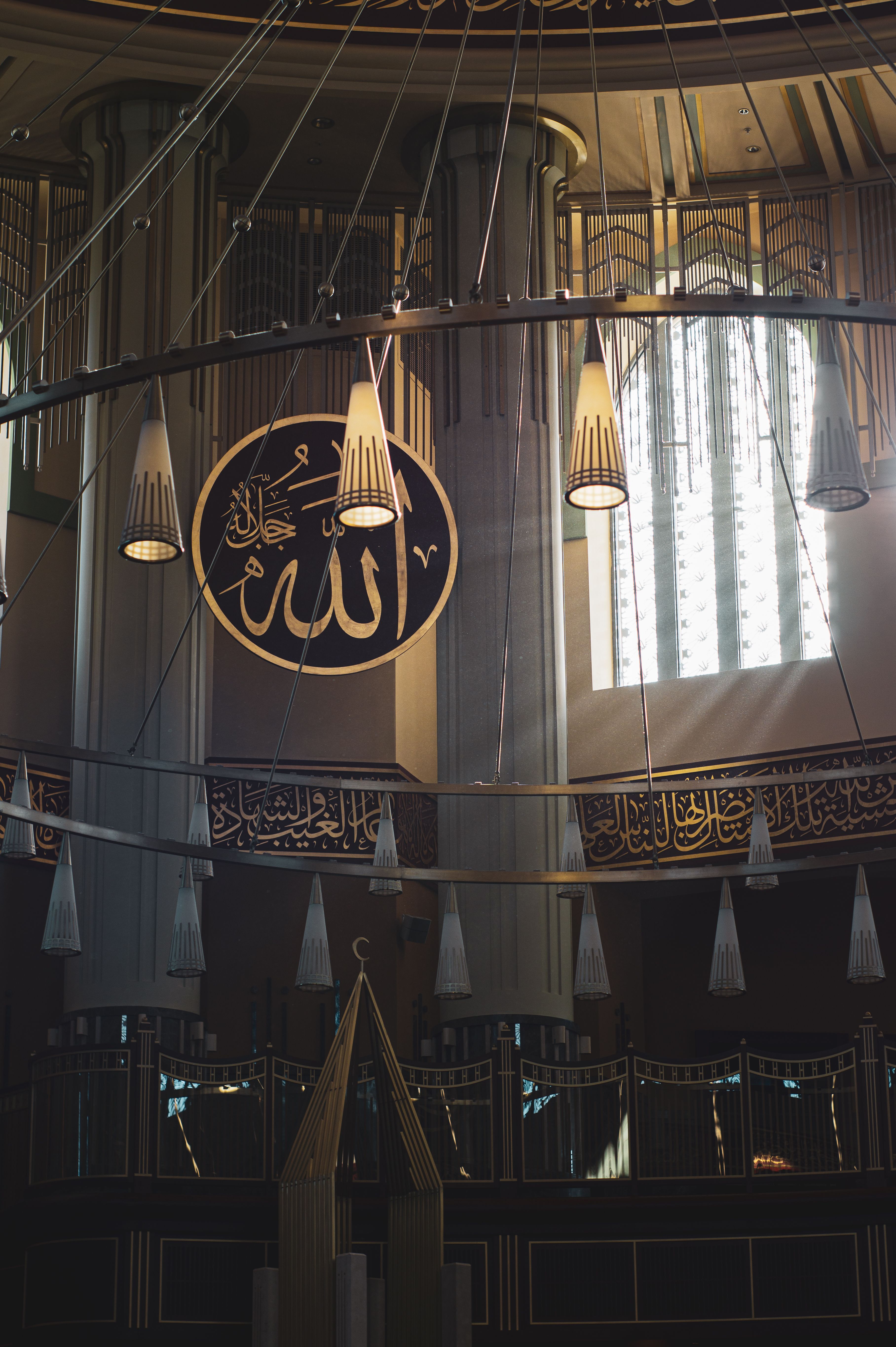 A beautiful mosque interior showcasing Islamic calligraphy and architectural design.