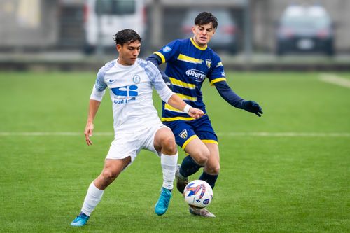 Free Two young male soccer players in action during an outdoor soccer match, displaying skill and competition. Stock Photo