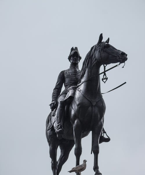 Man Riding Horse Statue