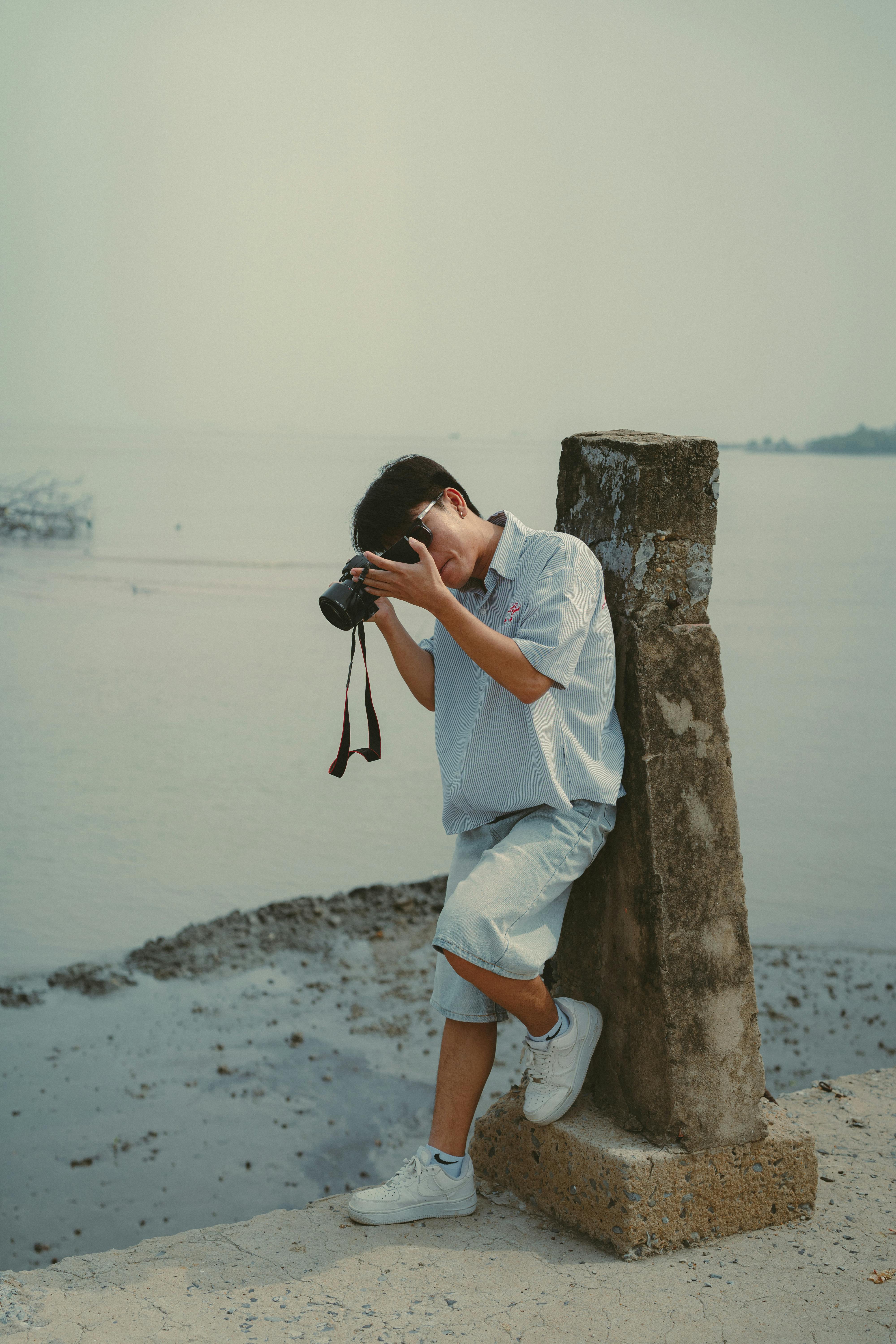 young photographer at ho chi minh city shoreline