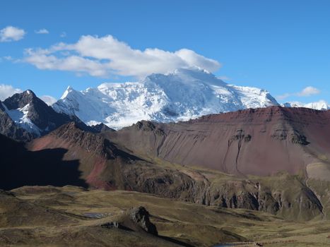 Majestic snow-capped peaks of the Andes mountains under a clear blue sky.