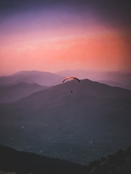 Free Person Riding Parachute Stock Photo