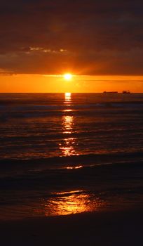 Beautiful sunset over the ocean with warm vibrant colors reflecting on the waves.