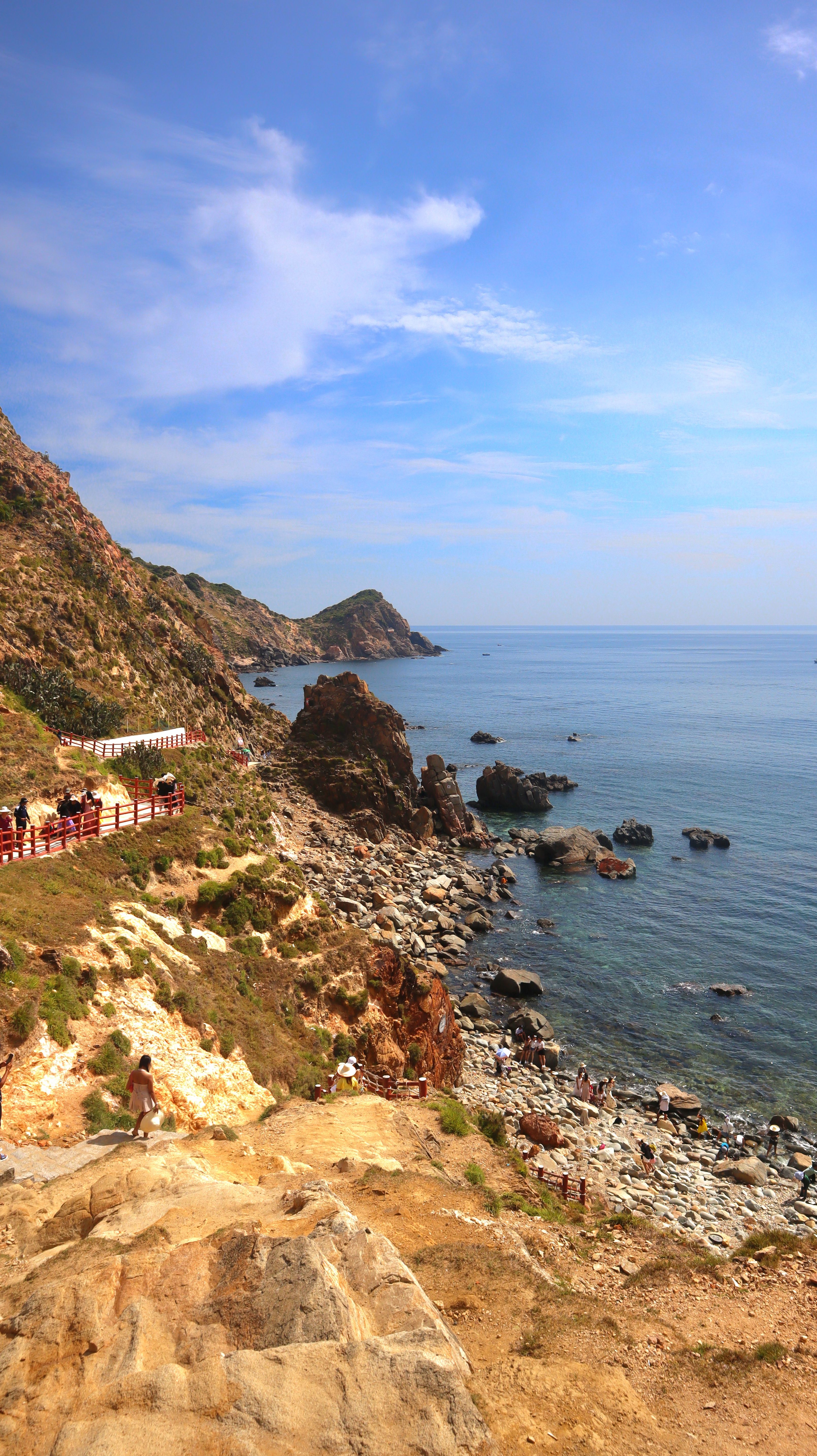 Breathtaking view of the rocky coastline in Quy Nhon, Vietnam, under a clear blue sky.