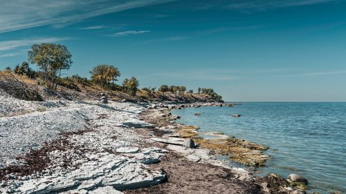 Free Picturesque Baltic Sea coastline with rocky shore under a clear blue sky. Stock Photo