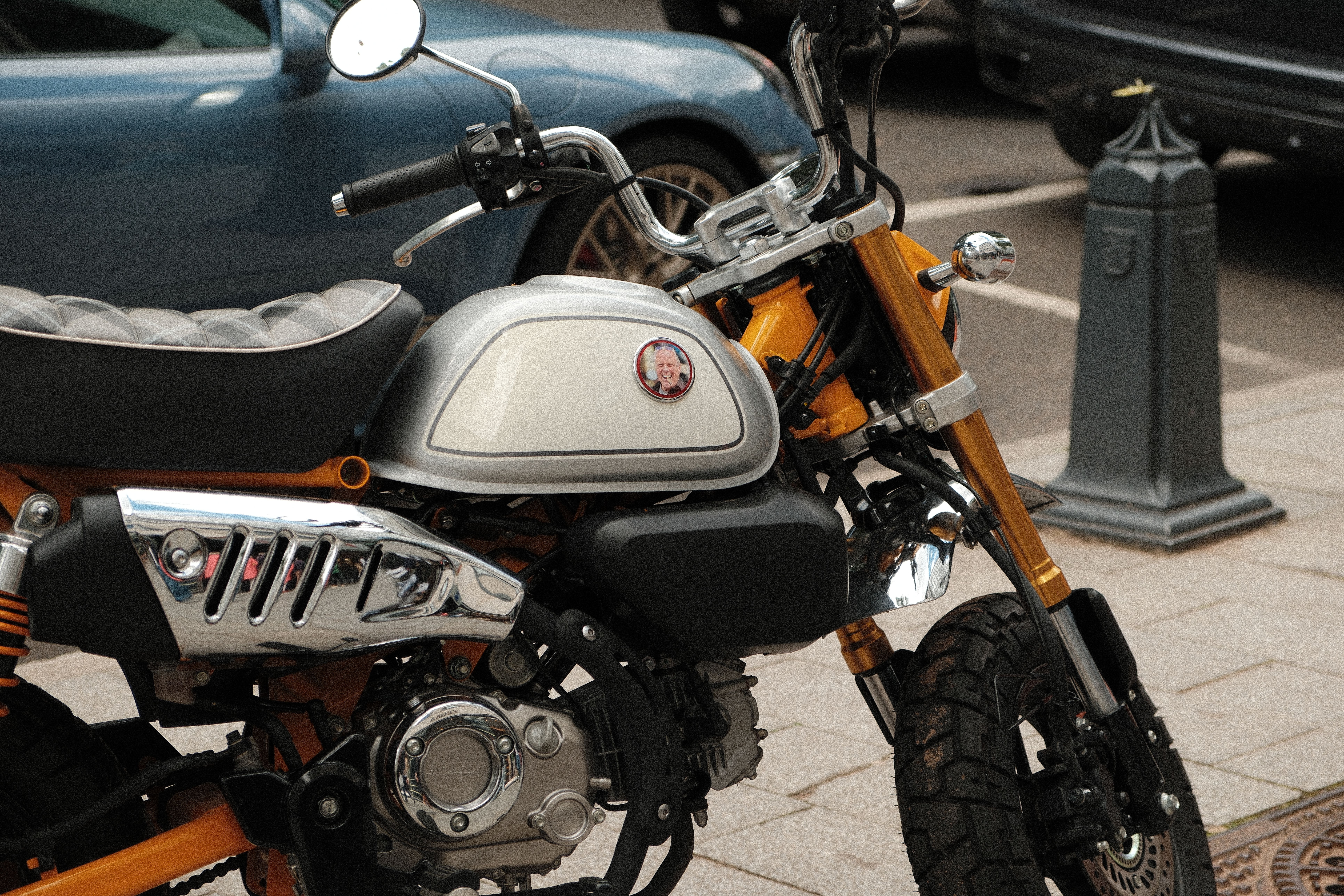 Vintage-inspired mini motorbike parked on street · Free Stock Photo