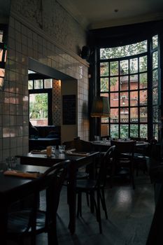 A cozy cafe in London, England, featuring large windows and autumn ambiance. Ideal for travel and lifestyle themes.