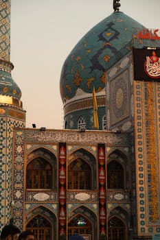 Beautiful Islamic architecture of a mosque in Tehran showcasing intricate tile work and vibrant colors at sunset.