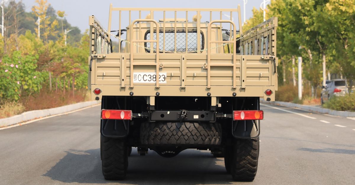 Rear View of Military Transport Vehicle on Road ยท Free Stock Photo