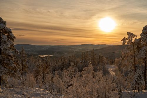 Free Peaceful snowy landscape with sunset over Krøderen, Norway, capturing winter's serene beauty. Stock Photo