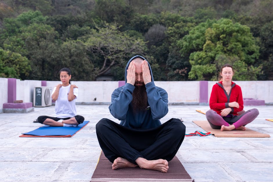 A peaceful yoga session taking place in a natural, outdoor setting - holistic addiction treatment center A peaceful yoga session taking place in a natural, outdoor setting - holistic addiction treatment center