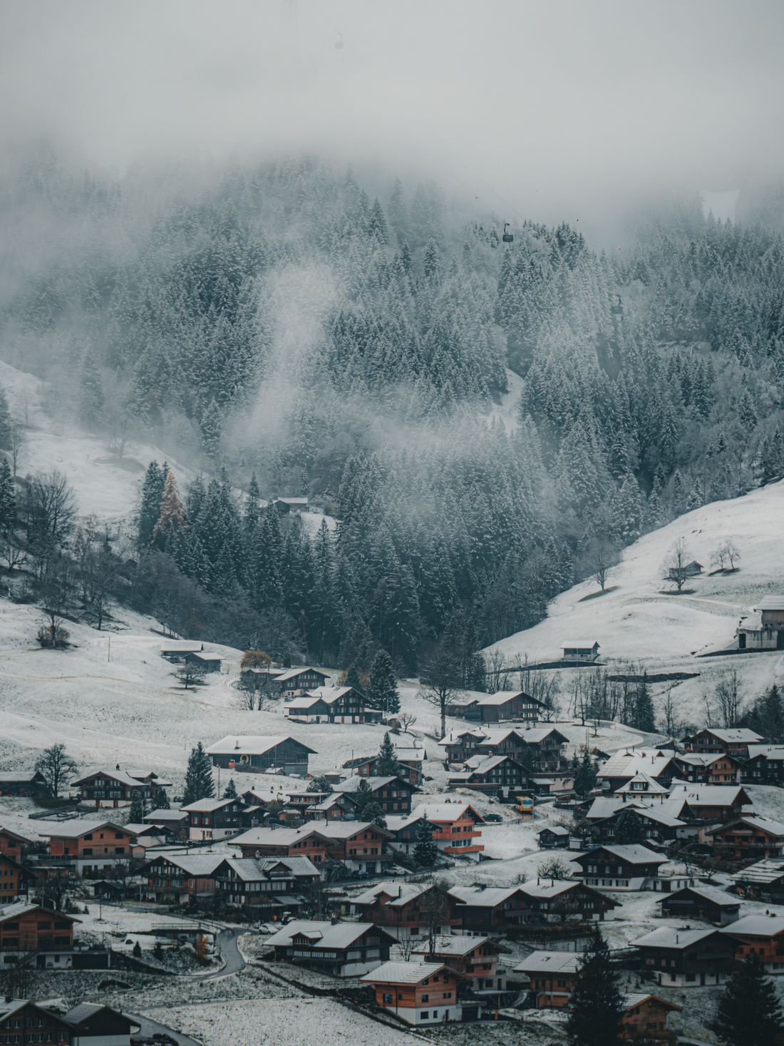 Winter panorama of Grindelwald village surrounded by the Swiss Alps