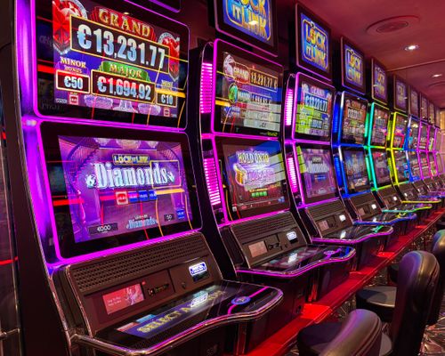 Vibrant Slot Machines in Casino Night Scene · Free Stock Photo