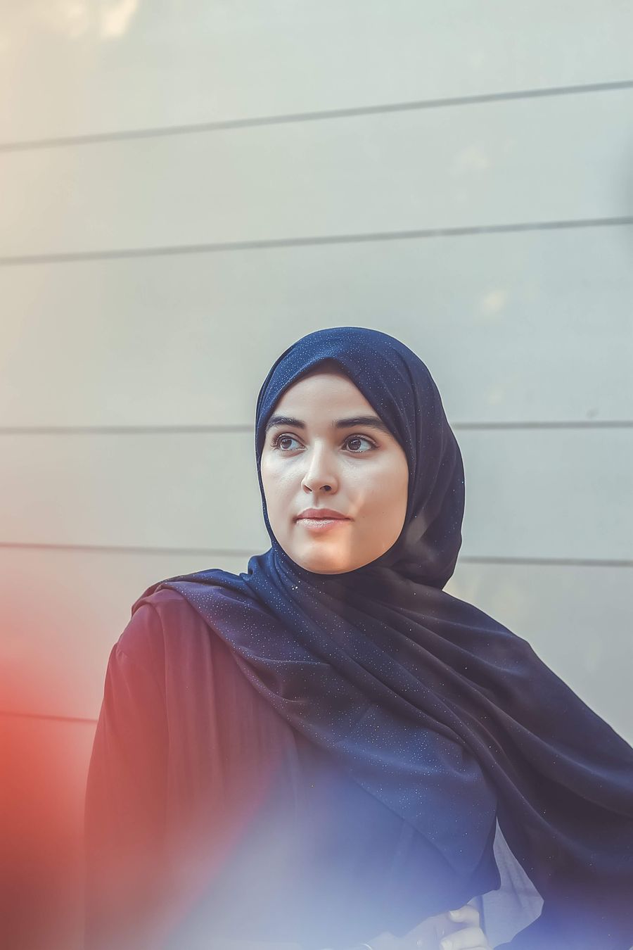 Woman wearing a soft hijab in warm light
