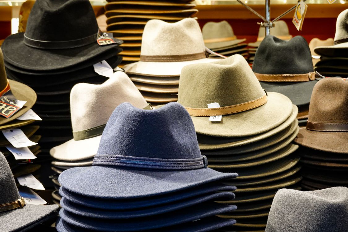 Stack of Fedora Hats on Display in Store · Free Stock Photo