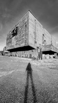 Black and white photo of an abandoned Soviet structure in Kutaisi, Georgia.