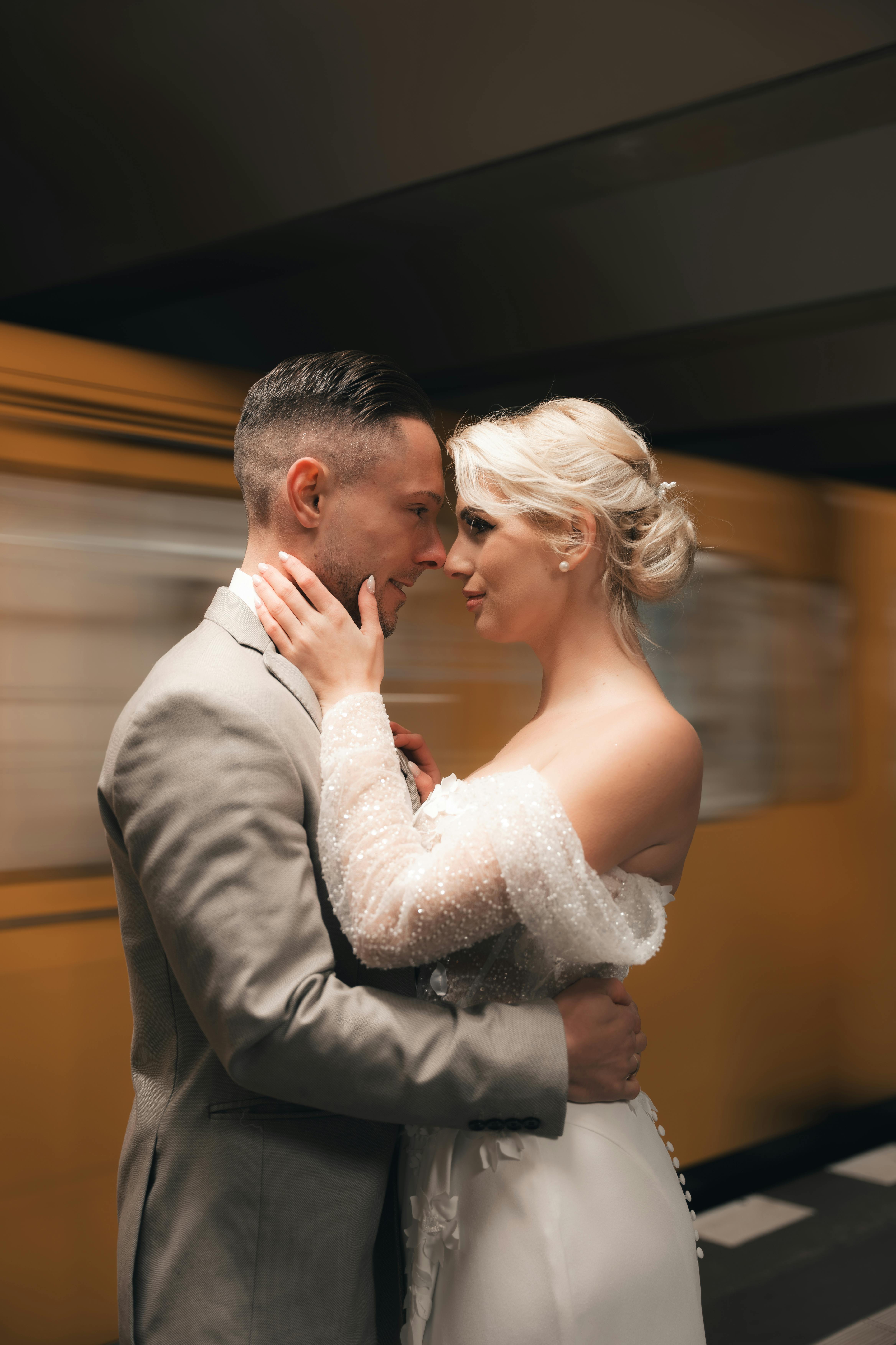 elegant newlywed couple in berlin metro station