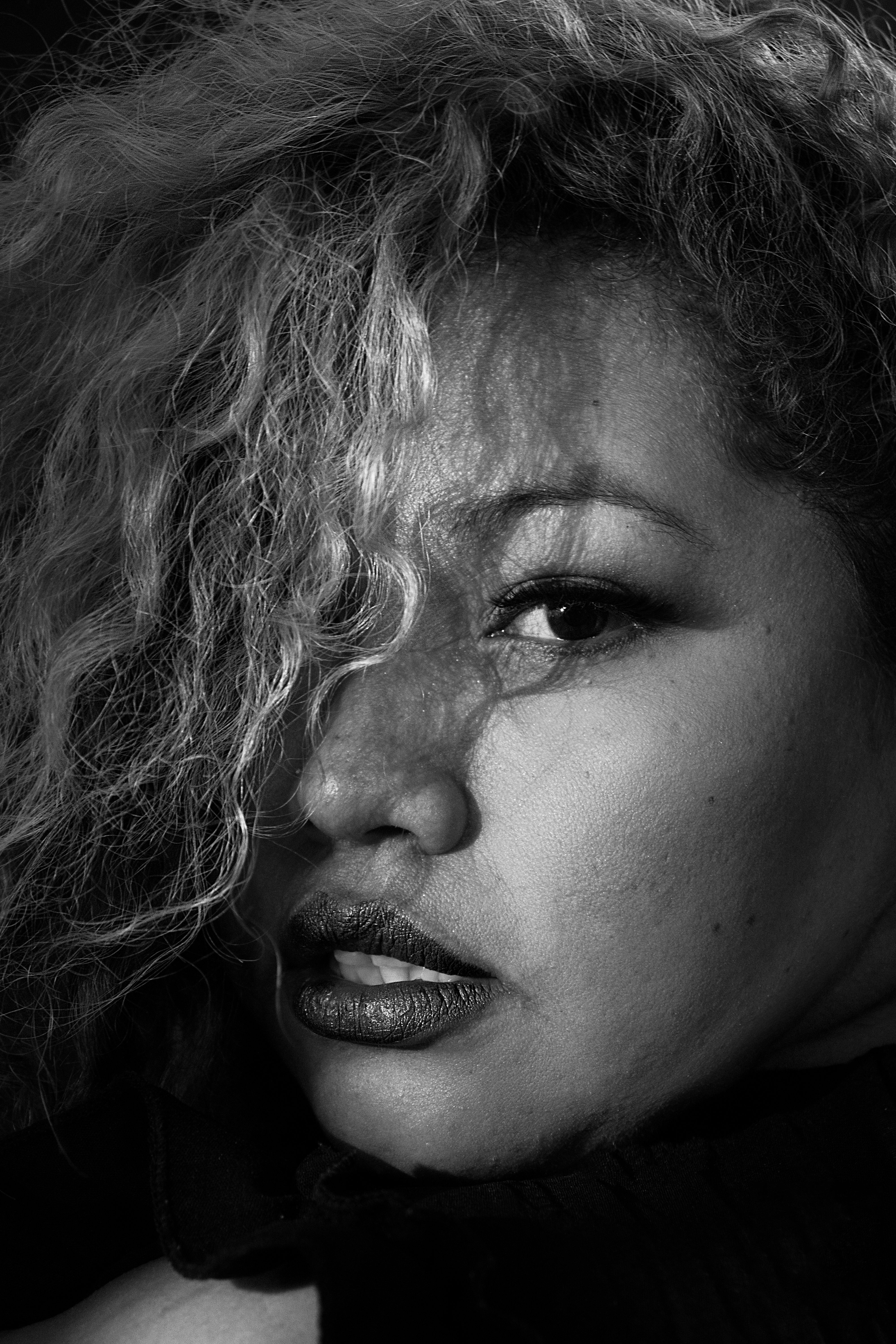 Black and White Portrait of Woman with Curly Hair · Free Stock Photo