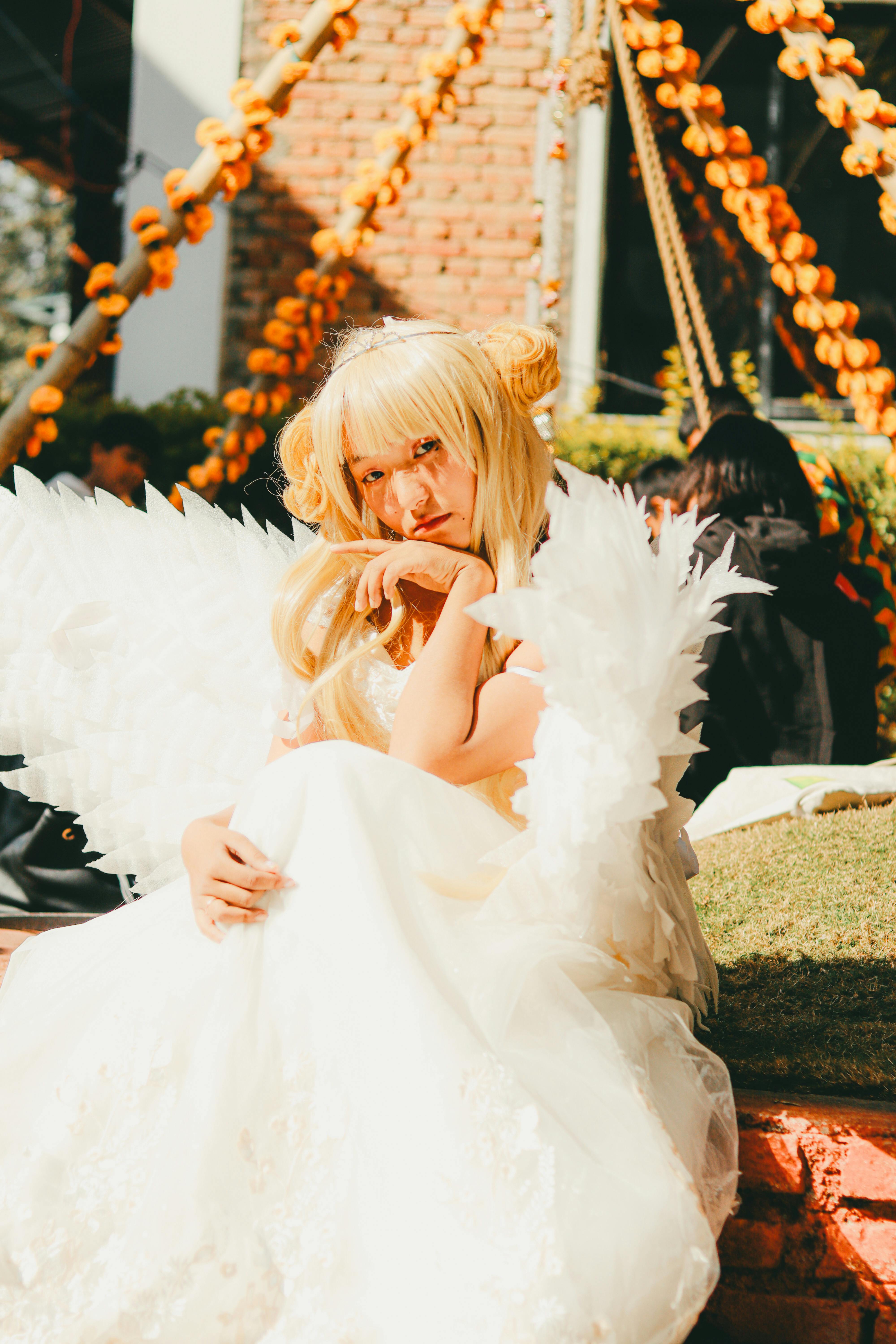 A captivating anime cosplay character with angel wings, set in vibrant Kathmandu.
