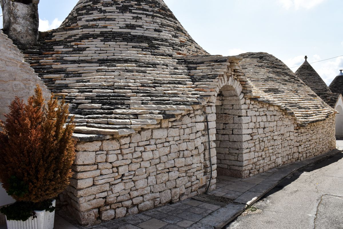 Alberobello's trulli — over 1,000 conical stone houses built without mortar in a single UNESCO hillside.