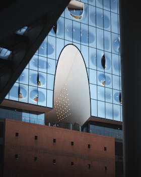 Close-up of the Elbphilharmonie's modern glass facade in Hamburg.
