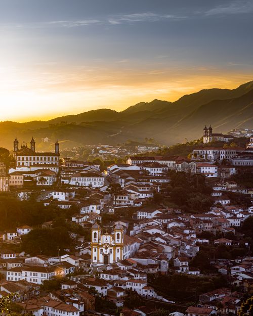 Free A breathtaking sunset view of Ouro Preto, Brazil showcasing historic colonial architecture. Stock Photo