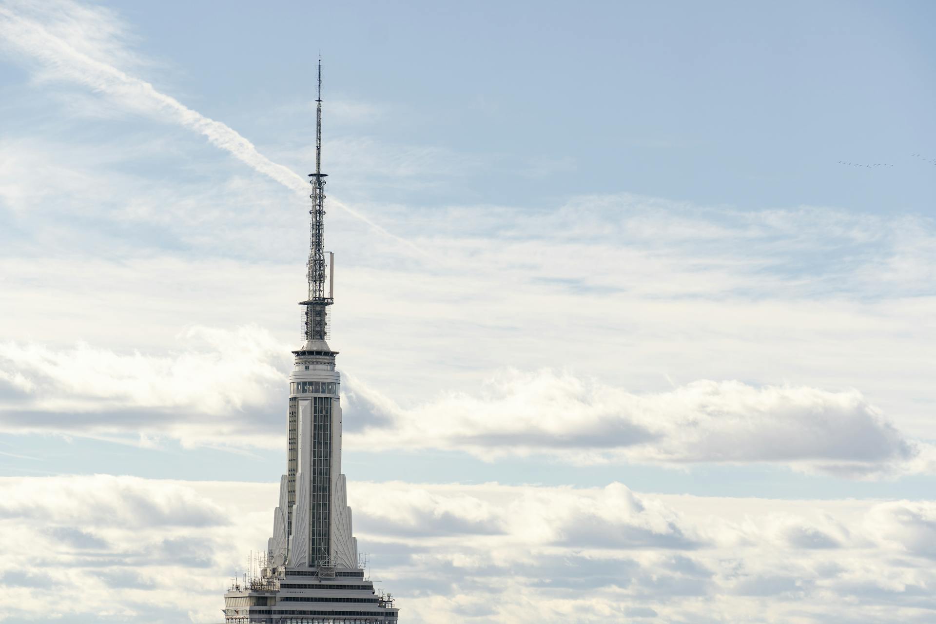 Stunning view of Empire State Building with a clear sky backdrop in New York City.