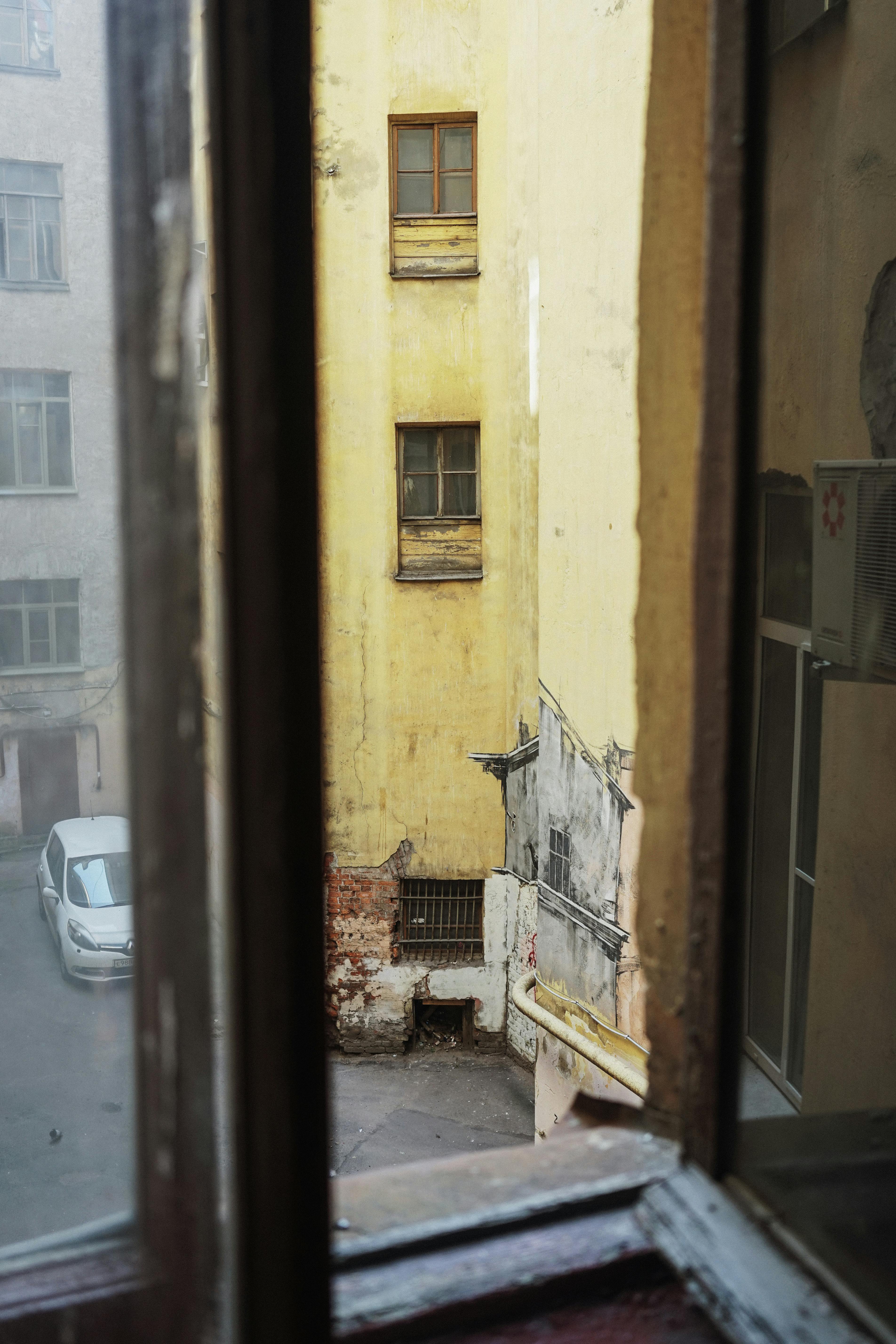 urban courtyard view through window frame