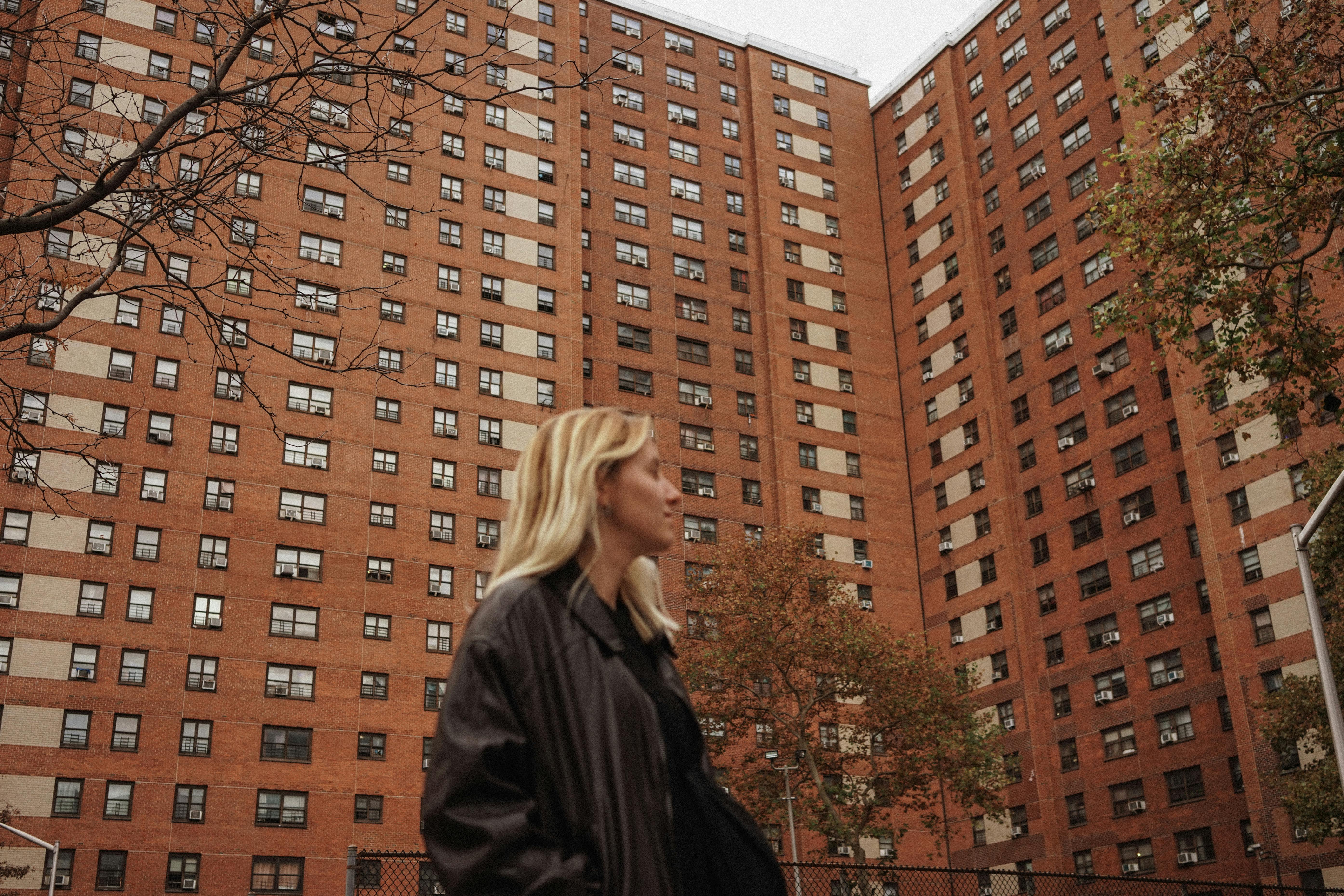urban architecture with woman walking outdoors