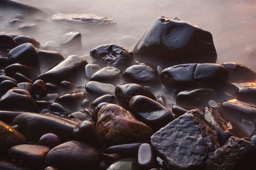 Free Long exposure of rocks at Lake Superior's shoreline in Ontonagon, Michigan. Stock Photo
