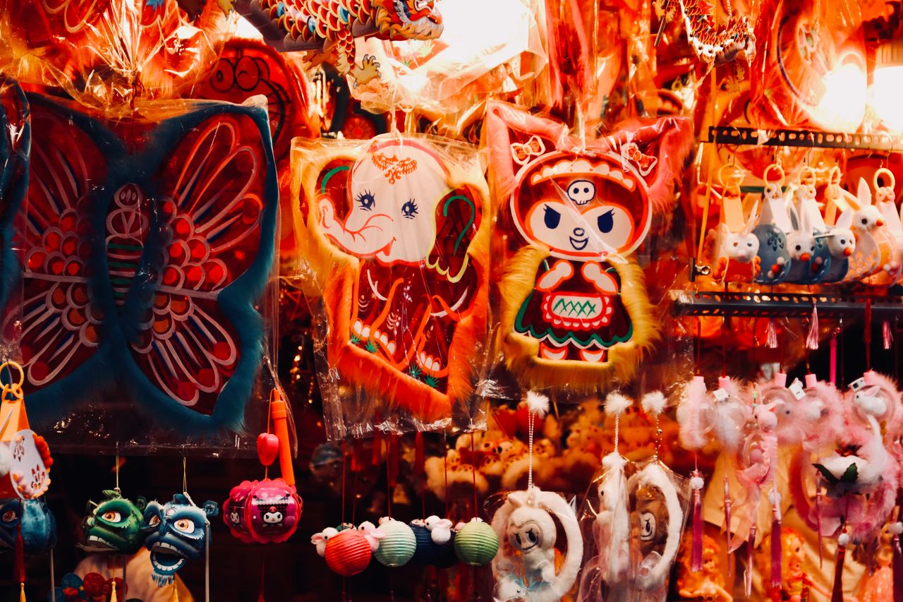 vibrant display of traditional paper decorations in an outdoor market
