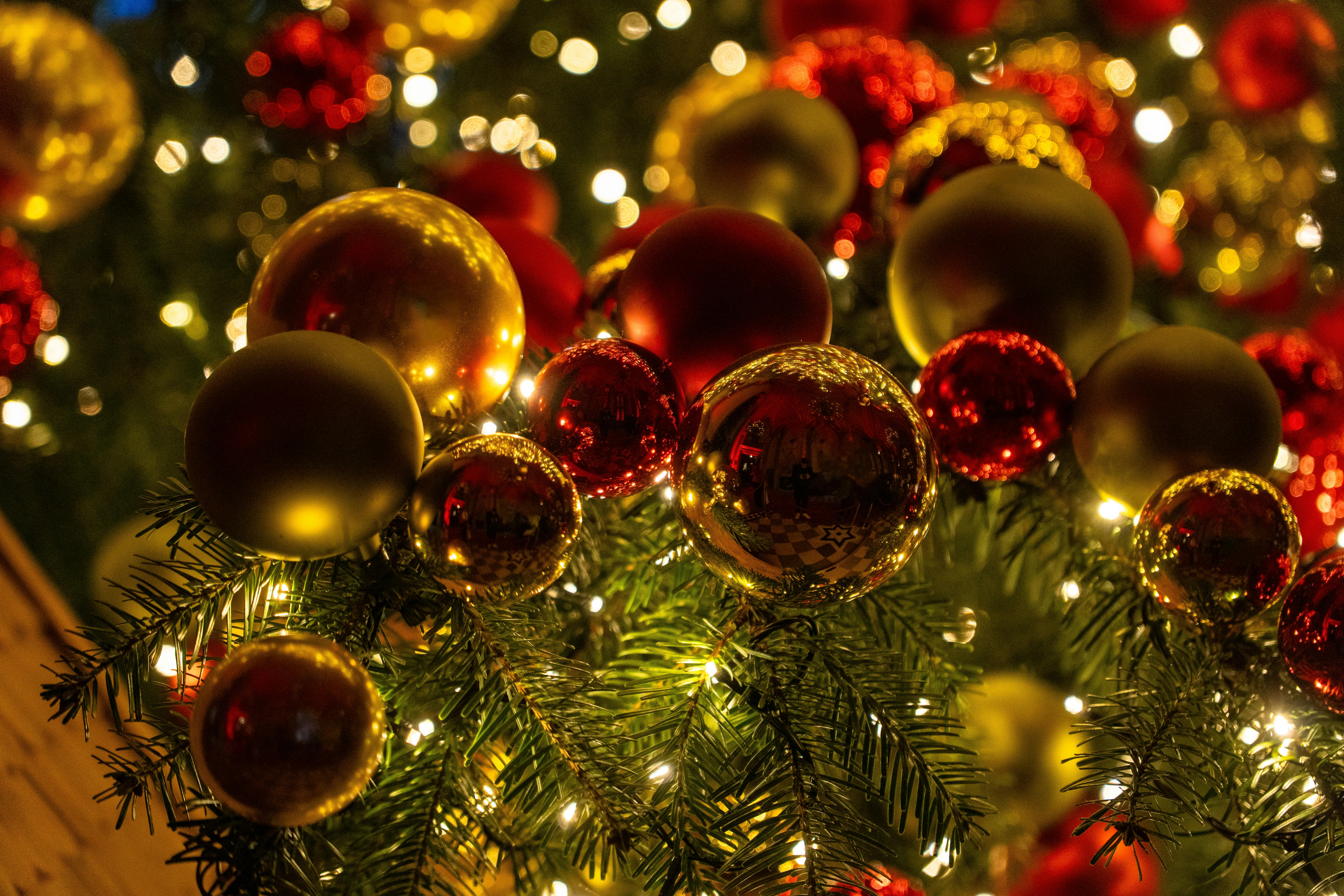 festive christmas tree with red and gold baubles