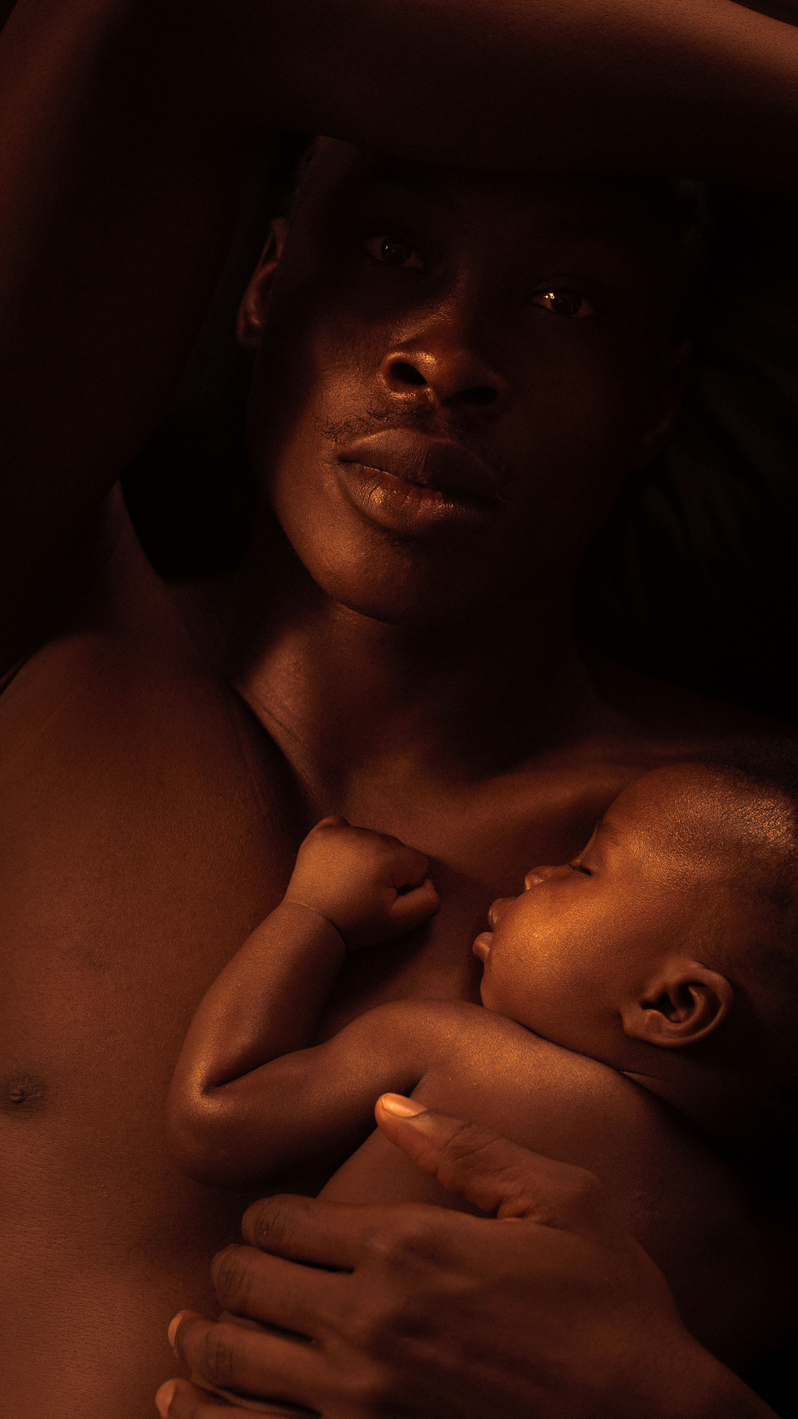 A serene image of a father holding his sleeping baby close, showcasing warmth and love.