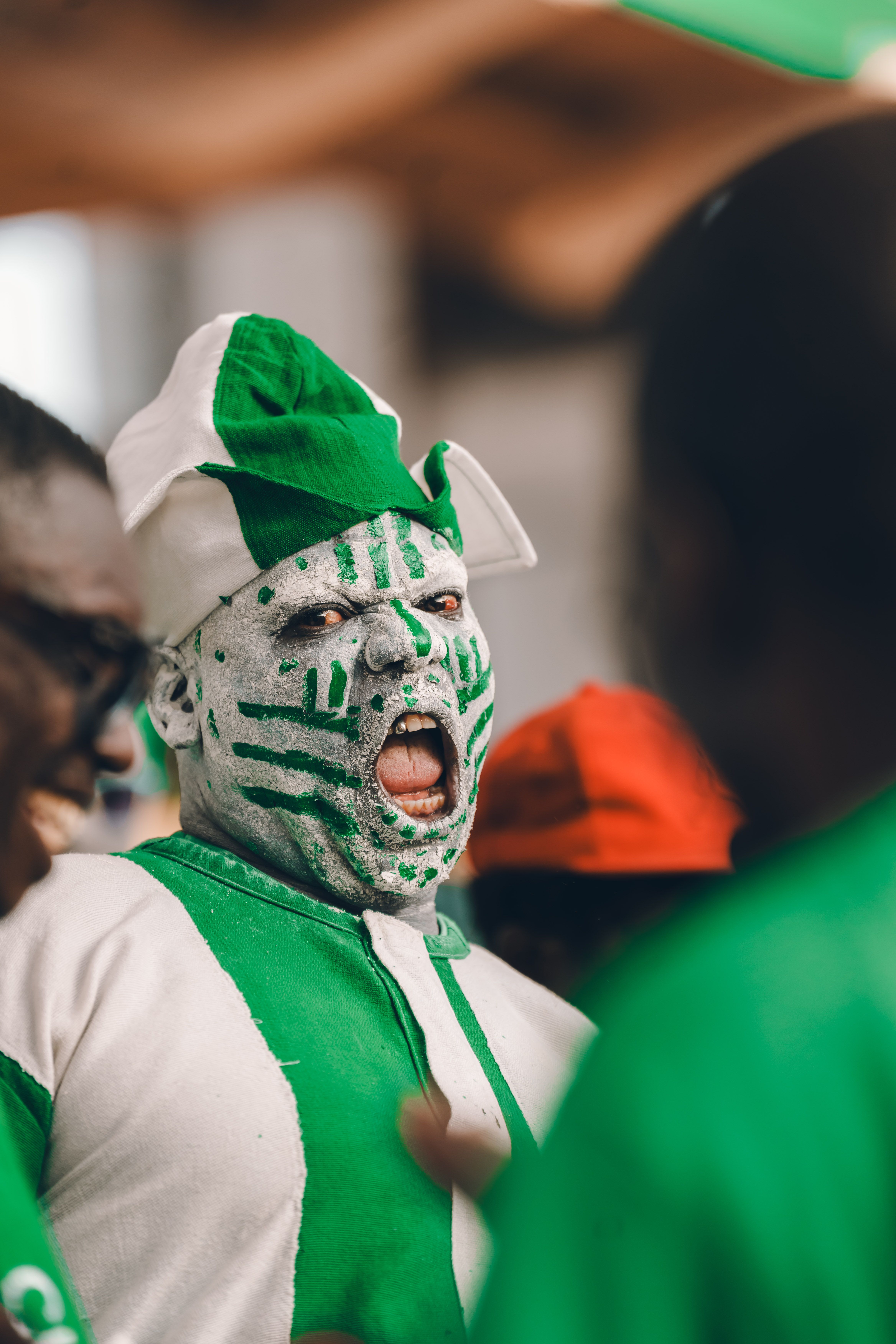 Vibrant Nigerian Fan at Cultural Event · Free Stock Photo