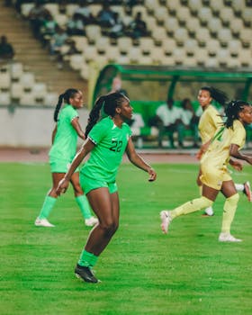 Dynamic shot of a women's football match, highlighting skill and teamwork on the field.