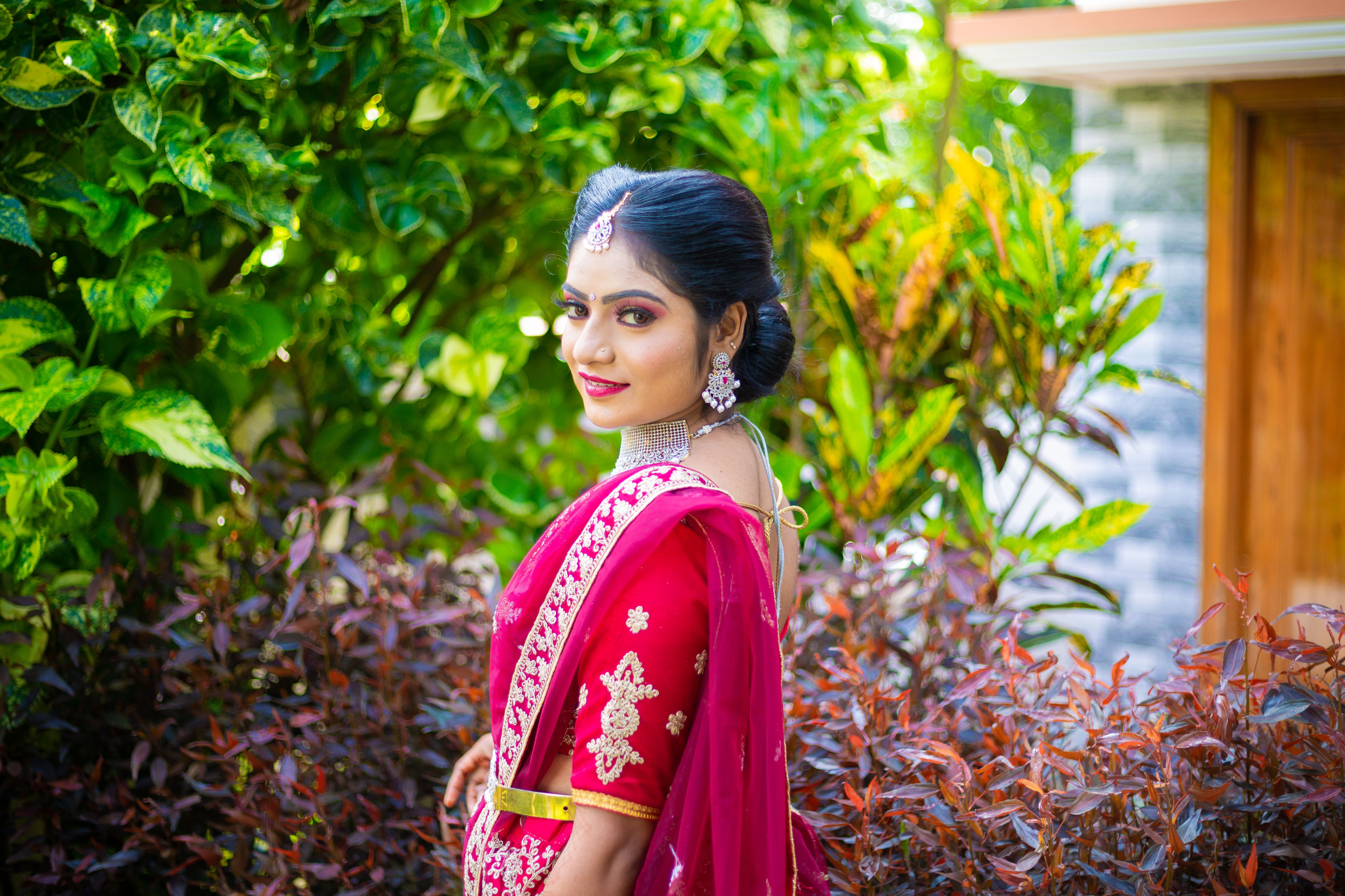 Elegant Woman in Traditional Red Sari Outdoors · Free Stock Photo