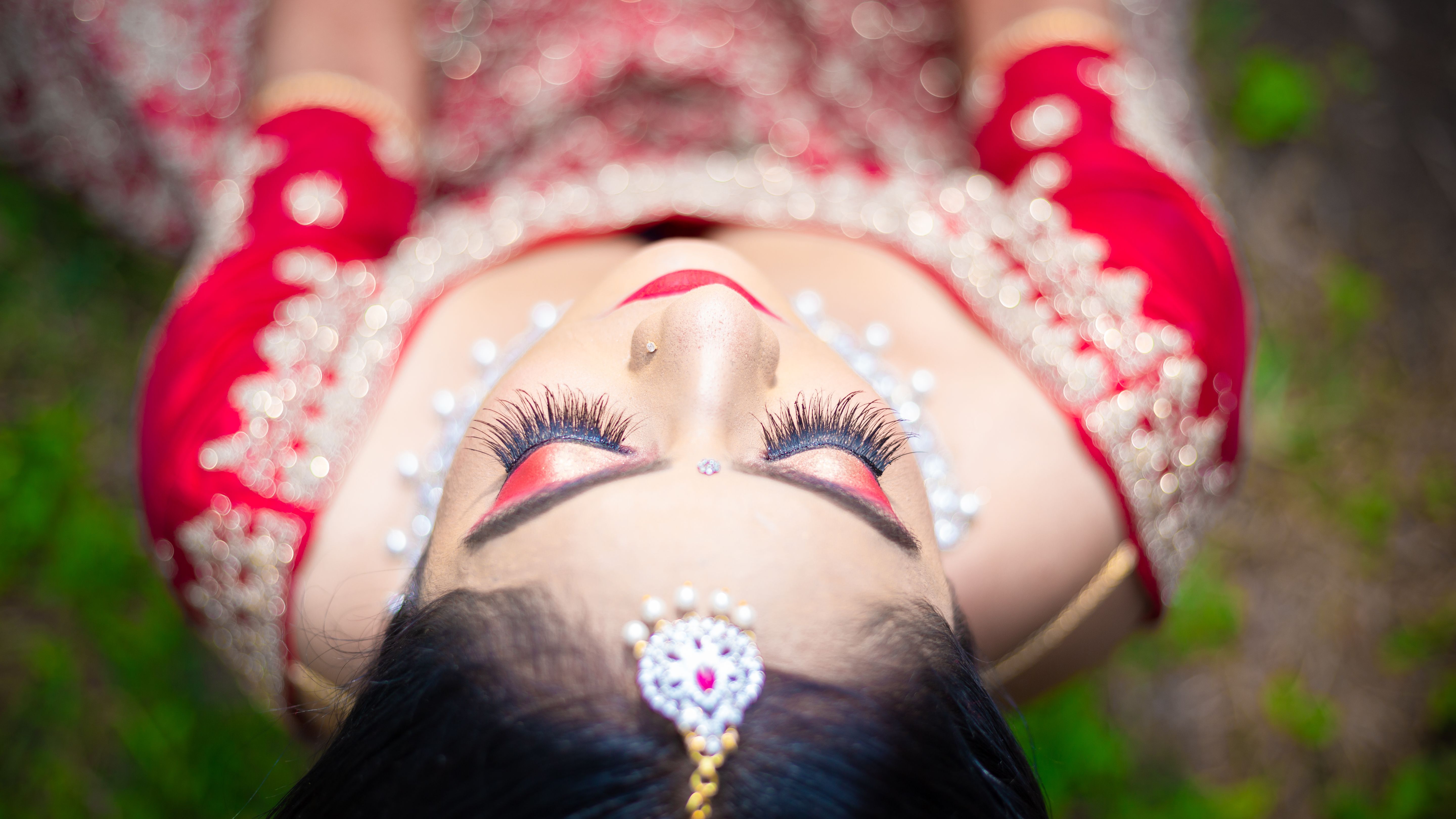 Beautiful close-up of an Indian bride in traditional attire and jewelry.