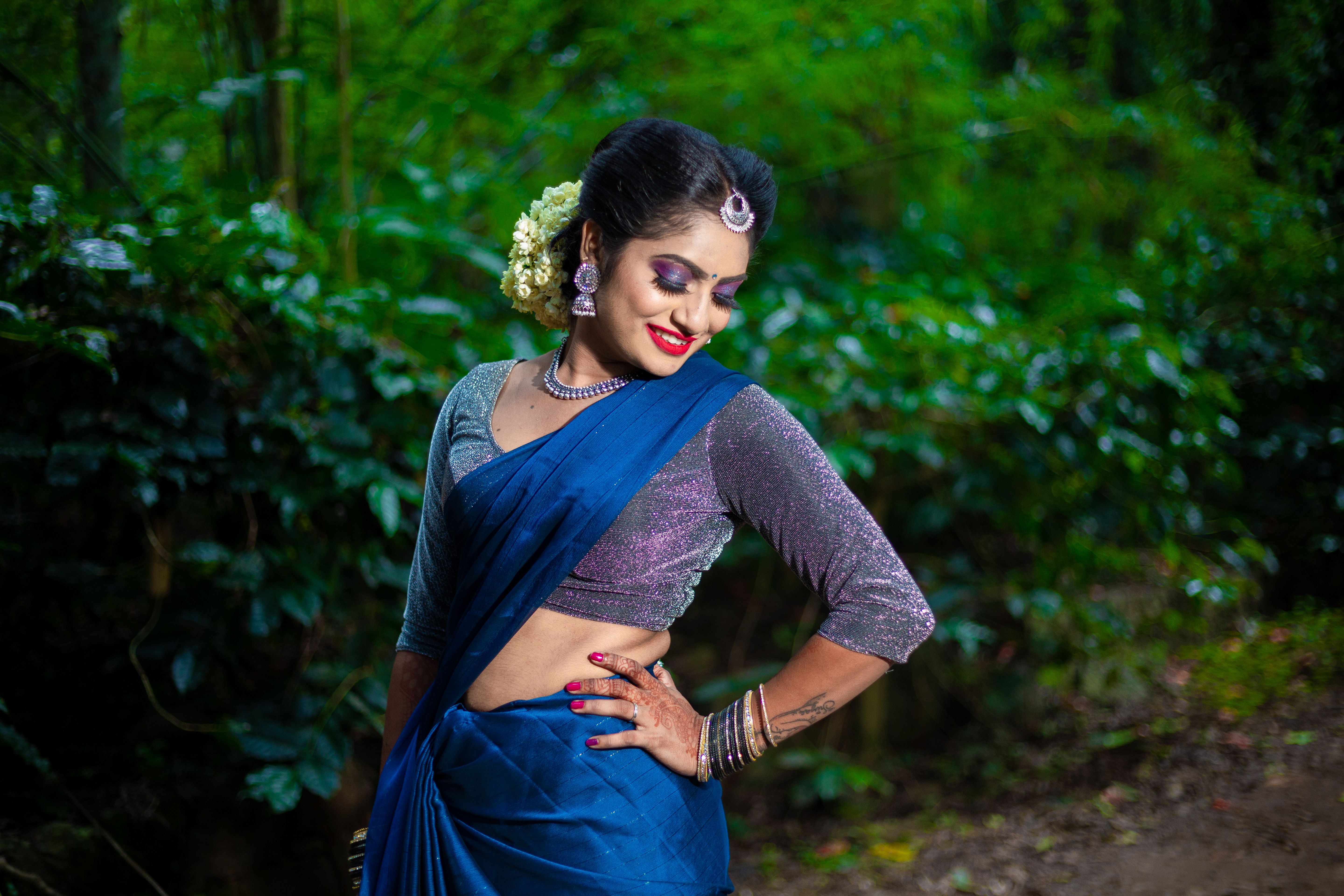 Elegant Woman Posing in Traditional Attire Outdoors · Free Stock Photo