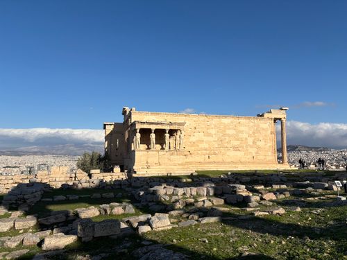 Free Erechtheion Temple on Athens' Acropolis against a clear sky, showcasing classical Greek architecture. Stock Photo